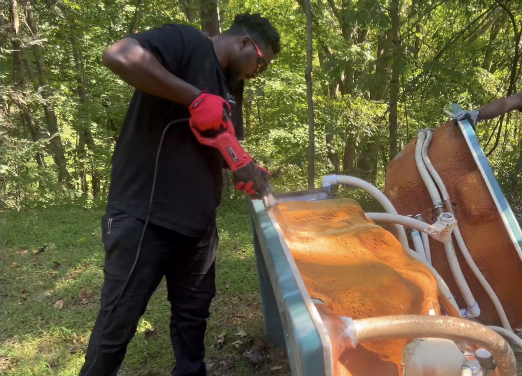East Boys Junkies breaking down a large item for removal